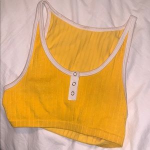 Yellow crop tank with buttons